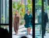 two women walking and talking during a justice summit